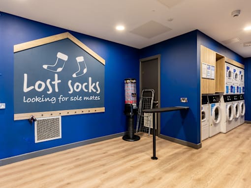 A laundromat with a sign that says Lost Socks.