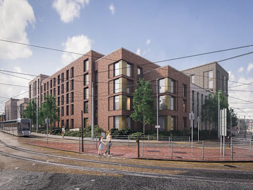 A modern brick building with a street in front of it.
