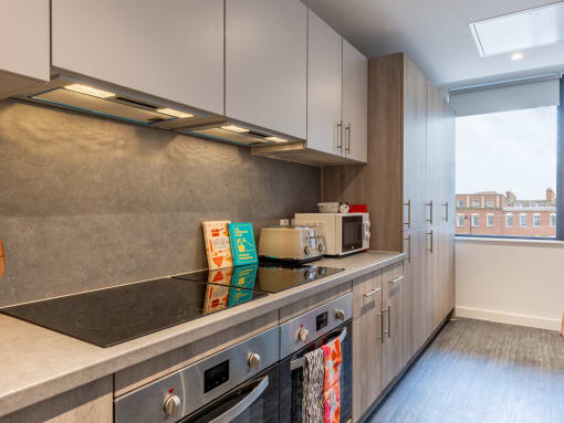 a kitchen with a counter top and a window