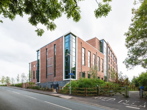 a view of the new building from the side of the road