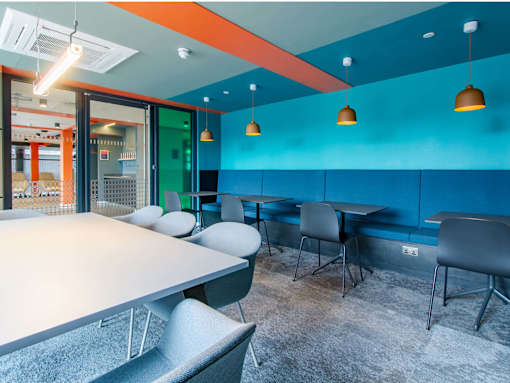 Study area, filled with chairs and tables for group or independent study
