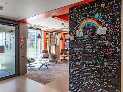 A chalkboard with various messages written on it.