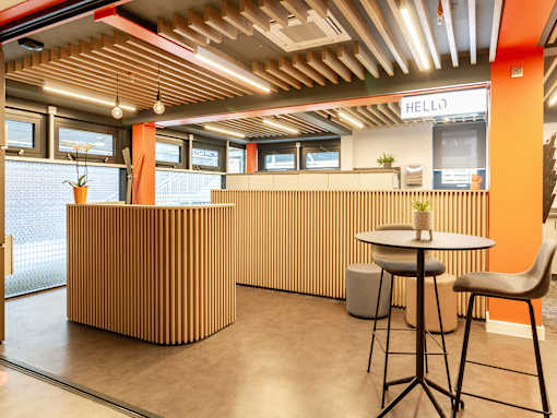 Bright reception space with brown panelling.