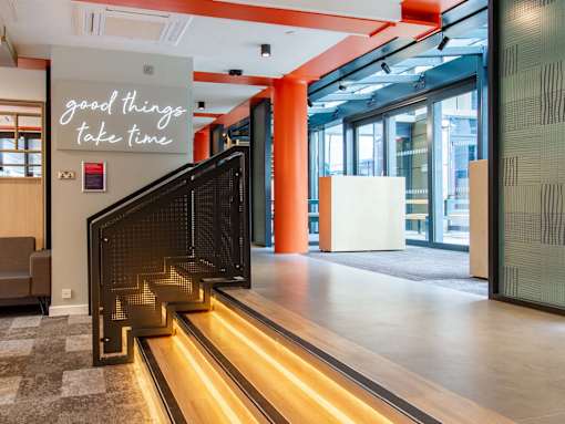 3 stairs with under-lighting and railing, from corridor leading to courtyard to ground floor social space.