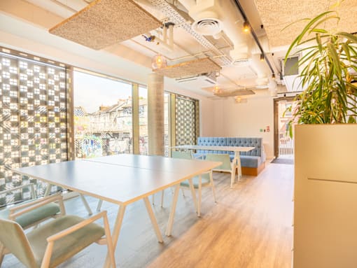 A conference room with a long table and chairs.