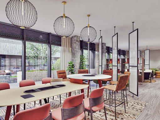 A modern dining room with a round table and chairs.