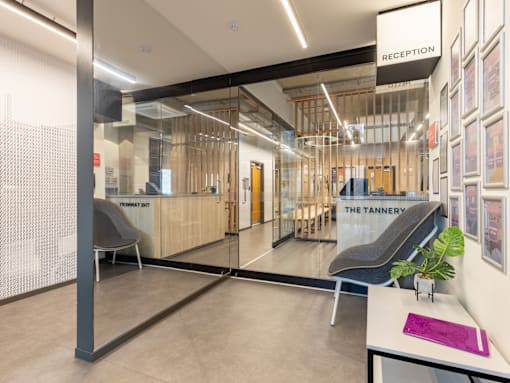 A reception area with a sign that says "Reception" on the wall.