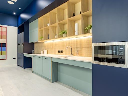 A modern kitchen with a blue and white color scheme.