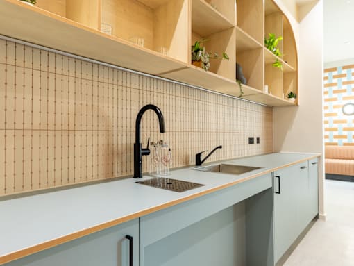 A kitchen with a sink and a counter.