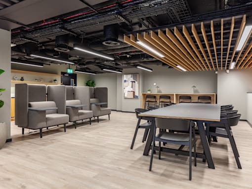 An open study and co-working space with a long table and chairs.