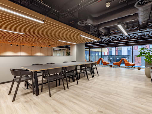 An open study and co-working space with a long table and chairs.