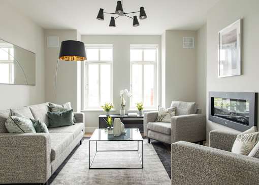 a living room with couches and chairs and a coffee table