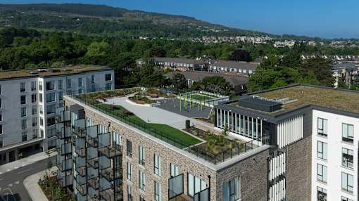 an aerial view of a building with a green roof