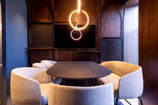 a dining room with a table and chairs