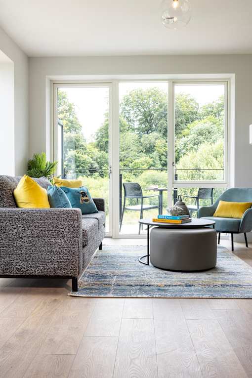 a living room with couches and chairs and a coffee table