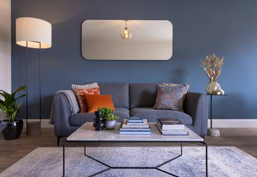 a living room with a gray couch and a coffee table