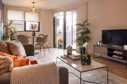 a living room with a couch and a table and a television