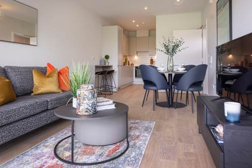 a living room and dining room with a couch and a table