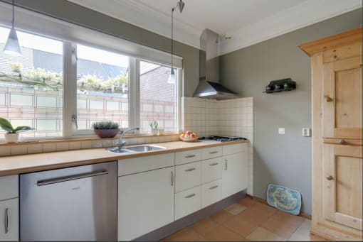 a kitchen with a sink and a window