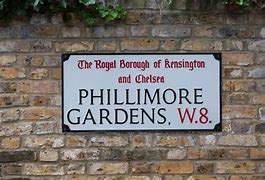 a sign on the side of a brick building
