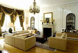 a living room filled with furniture and a fire place