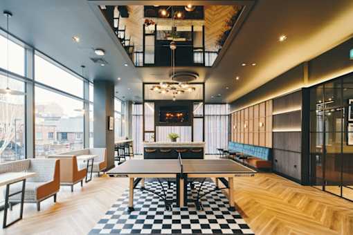a room filled with furniture and a large window
