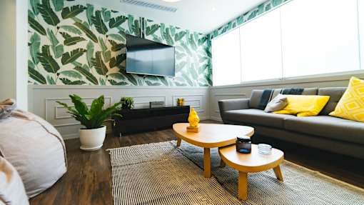 a living room with a couch coffee table and television