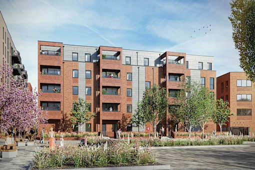 A modern apartment complex with red brick buildings and a courtyard with trees and people.