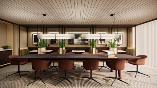 A conference room with a long table and chairs.