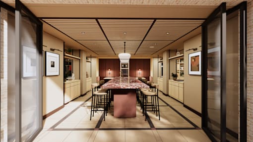 A long table with chairs is in the middle of a room.