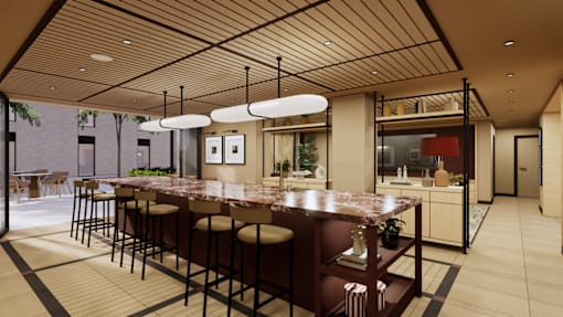 A modern kitchen with a bar area and a dining table.