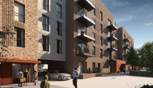A modern apartment complex with people walking around the courtyard.