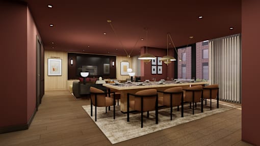 A conference room with a long table and chairs.