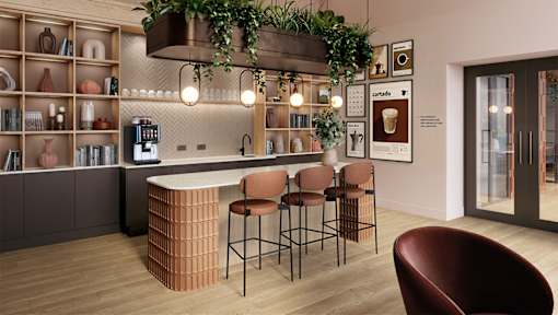 A modern bar with a wooden counter and stools.