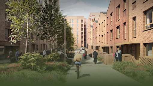 A street view of a residential area with people walking and a cyclist.