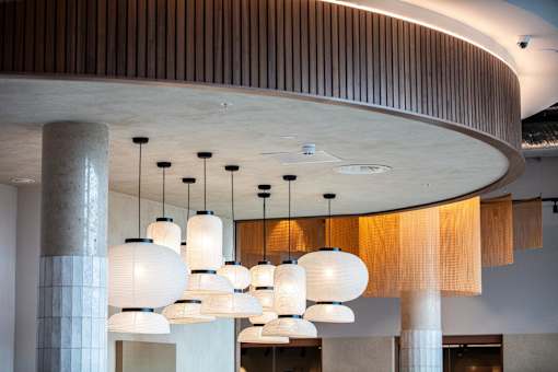 Series of white pendant lights at Fairfax Apartments, Manchester