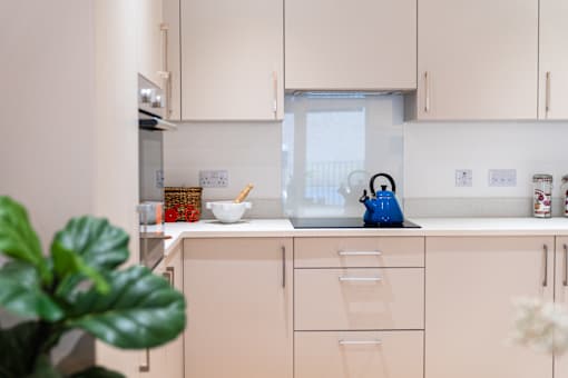 A kitchen with a blue kettle on the counter.at The Quarters Apartments, Dock Road, ME4 4UB