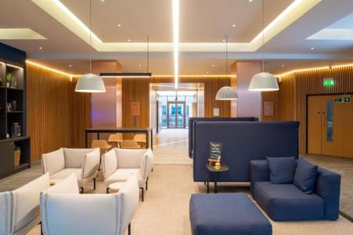 a lobby of a hotel with couches and chairs at The Keel Apartments, Liverpool