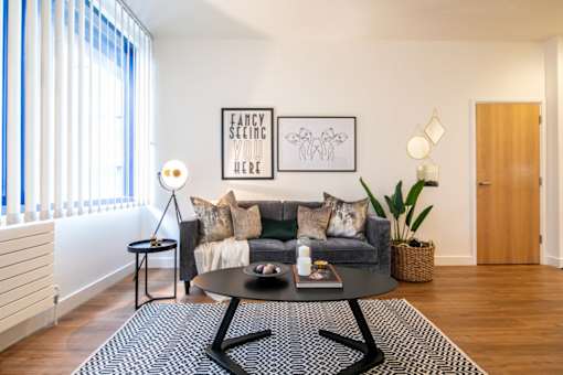 a living room with a couch and a coffee table at The Keel Apartments, Liverpool, L3 4GE