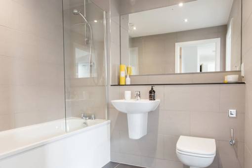 a bathroom with a sink toilet and a bath tub at Vox Apartments, Manchester, M15 4YD
