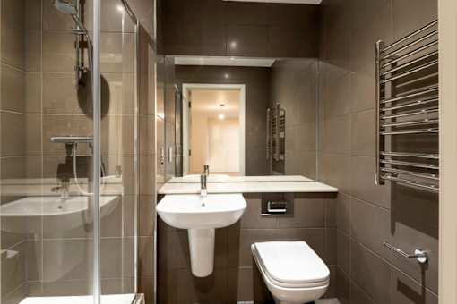 a bathroom with a sink toilet and a shower at The Trilogy Apartments, Manchester, M15 4RU