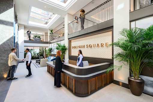 A reception area with a sign that says Dolphin Square.