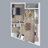 A top down view of a small apartment with a kitchen, living room, and bathroom at The Read, Los Angeles, CA 90016