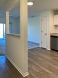 a kitchen with a built-in bar top next to the entryway
