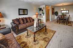 Large spacious living room with adjoining dining area at Kings Gate West Apartments, Camillus, NY, 13031