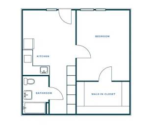 A floor plan of a small apartment with a kitchen, bathroom, bedroom, and walk-in closet.