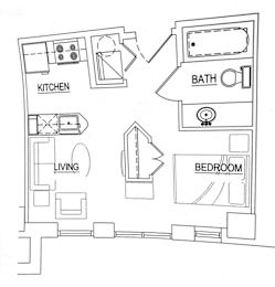 A floor plan of a small apartment with a kitchen, living room, and bedroom.