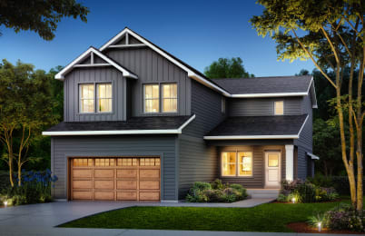 a home with a garage door in front of it