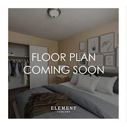 A bedroom with a bed, pillows, and a wall with pictures and a sign that says "FLOOR PLAN COMING SOON".