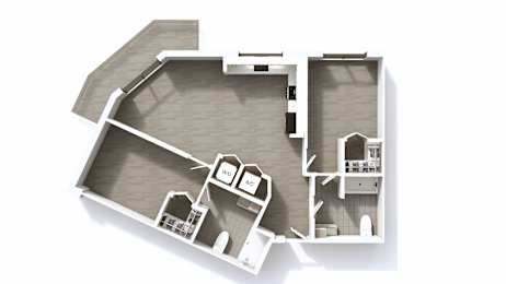 A white architectural model of a house with a kitchen and living room.